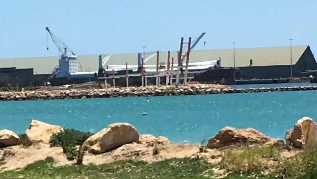 Wind turbines are unloaded from the ship at Geraldton Port today.