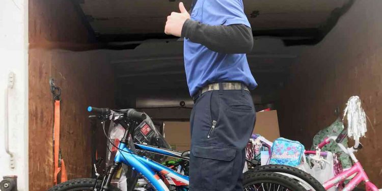 School system warehouse employees make Special Angel wish deliveries