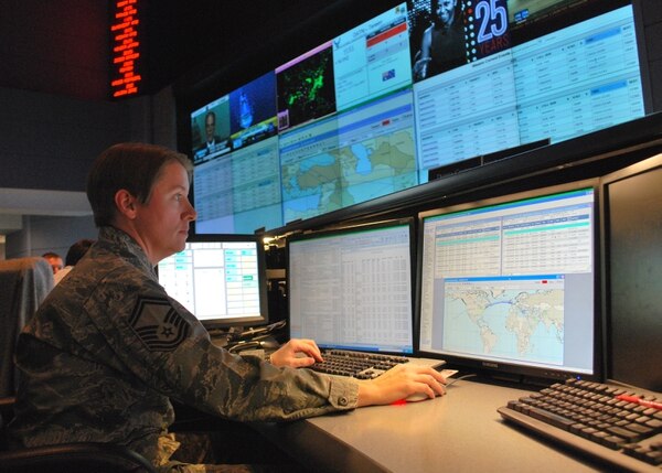 Senior Master Sgt. Donna Crone, pictured here at the 618th Air and Space Operations Center's 24-hour operations floor, works on the execution floor in 2010. (Capt. Justin Brockhoff/U.S. Air Force)