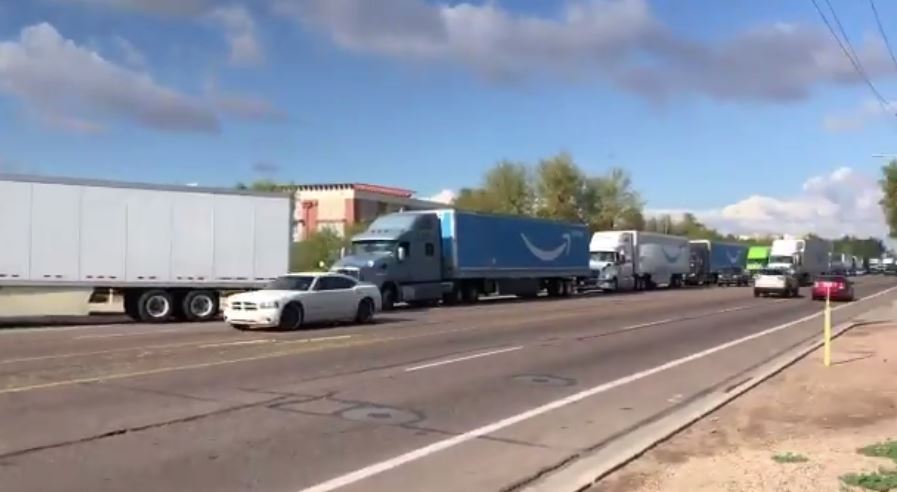 A line of trucks stranded outside a Phoenix Amazon fulfilment centre amid a 'security incident'