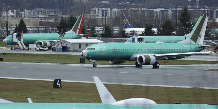 Boeing shares tumble on report of 737 Max production cuts