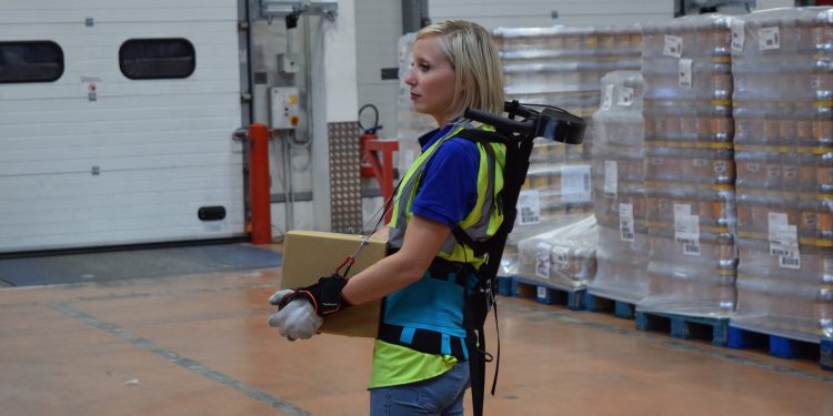 Relieving physical stress of warehouse workers through ergoskeletons that share loads