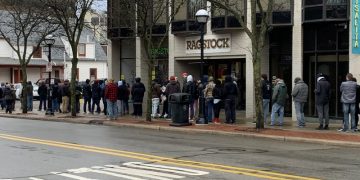 Hundreds line up at few stores open for 1st day of recreational marijuana sales