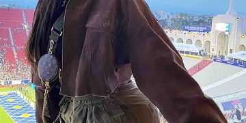 Jordyn Woods channels Kim Possible in green cargo pants as she cheers on the LA Rams with friends