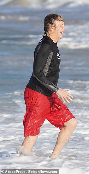 Casual: He was stepping out in a black long-sleeved top and a pair of red shorts