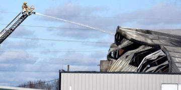 Burned warehouse too unstable to enter, fire chief says