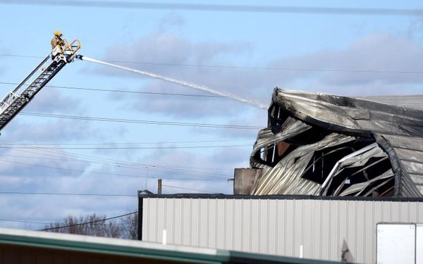 Burned warehouse too unstable to enter, fire chief says