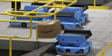 Warehouse workers adapt to robots
