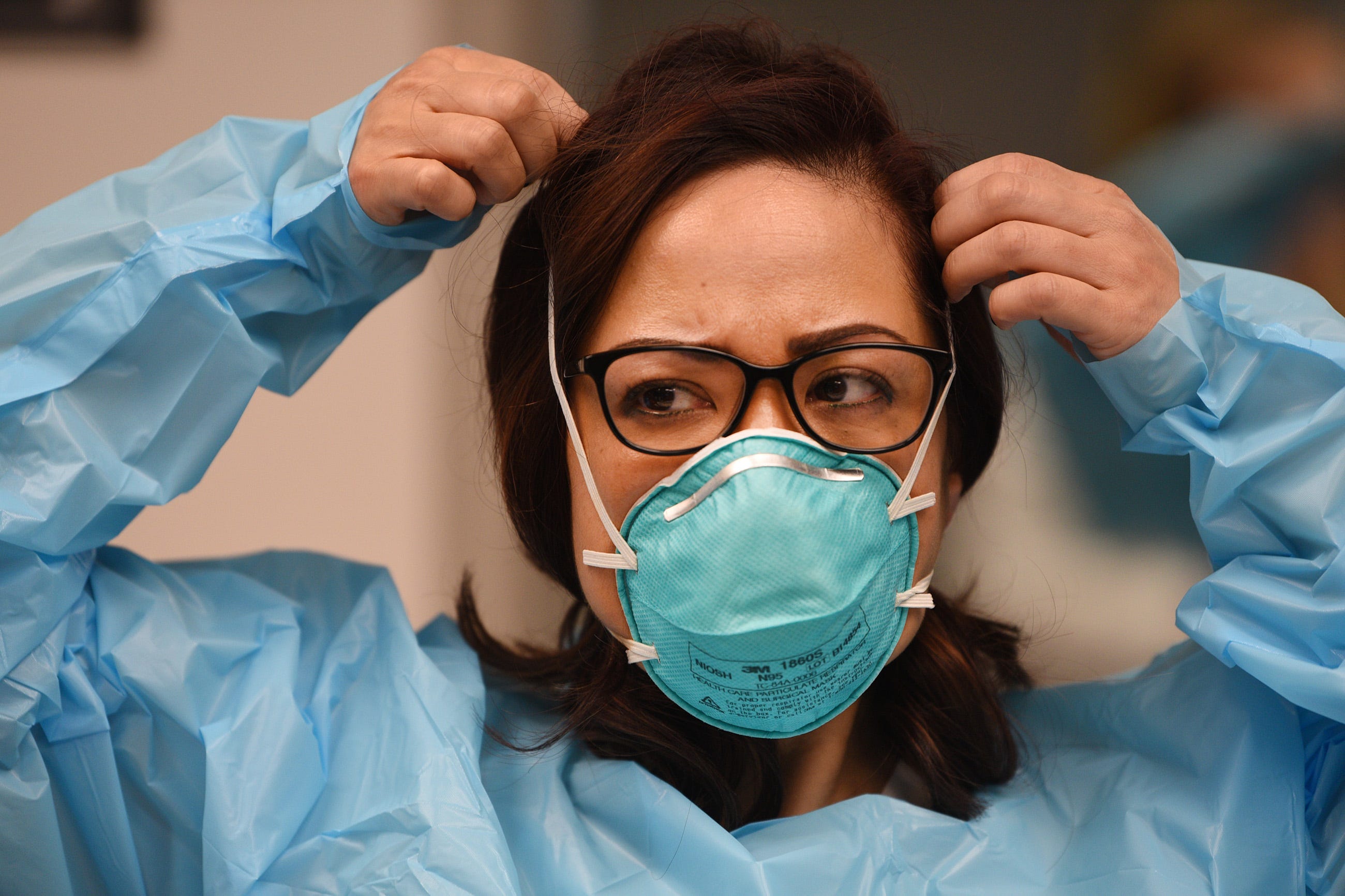 Nurse Jennifer Tempo, RN, puts on a mask during the Covid 19 Training with Personal Protective Equipment (PPE) at the hospital's simulation center at Holy Name Medical Center in Teaneck on 02/24/20. 