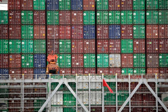 Cargo containers are stacked on a ship at the Port of Los Angeles in Los Angeles on June 19, 2019.