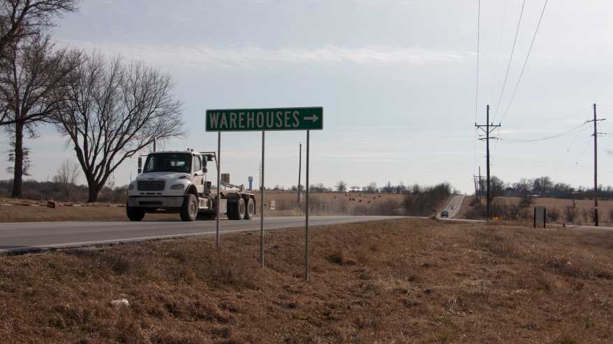 A semi truck whizzes past on Gardner Road.