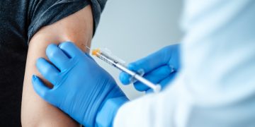 Vaccine rollout boosts medical waste volumes, as workers wait for their shot