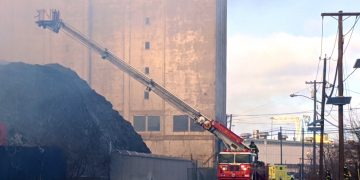 High Winds, Low Temps Send Auto Waste Smoke from Camden Scrapyard Fire Across Region