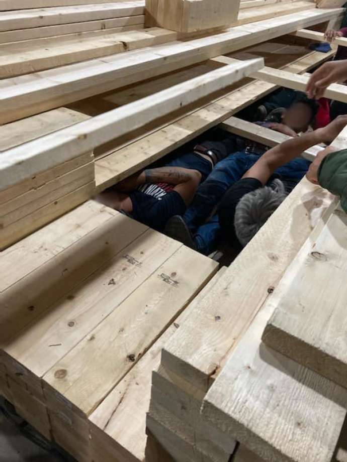 U.S. Border Patrol agents discovered 17 immigrants who were inside a compartment within a cargo of lumber. Photo: Courtesy Photo /U.S. Border Patrol