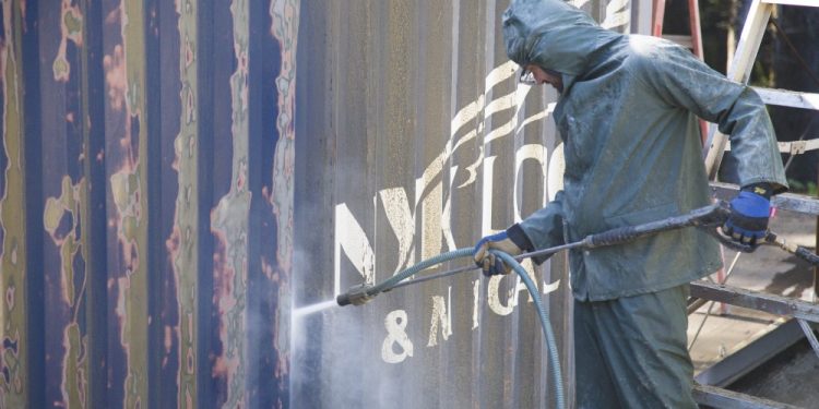 The battle to remove rust from weathered steel shipping containers