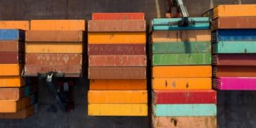 Sky-high container shipping rates may ease by this summer
