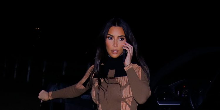 Kim Kardashian Elevates Her Cargo Pants With Booties & This Ab-Revealing Crop Sweater
