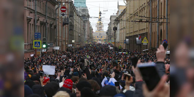 People attend a protest against the jailing of opposition leader Alexei Navalny in St. Petersburg, Russia, Sunday, Jan. 31, 2021.