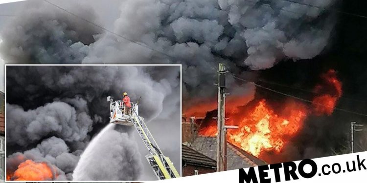 Major fire breaks out at warehouse in Manchester with people urged to shut windows