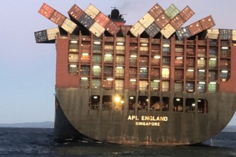 Containers cling precariously to  APL England after other cargo fell overboard in May last year.